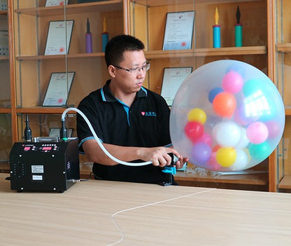 Μηχάνημα για γέμισμα μεγάλου μπαλονιού με μικρότερα